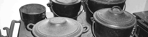 Cooking range with four cast iron pots